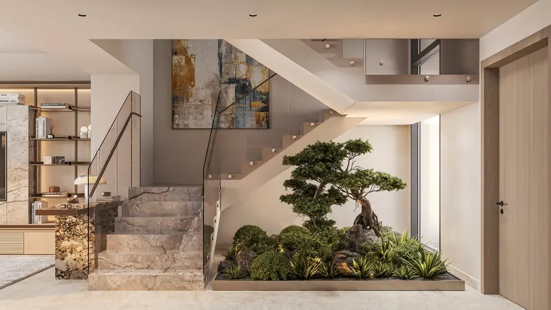 Double-height villa interior with stone staircase